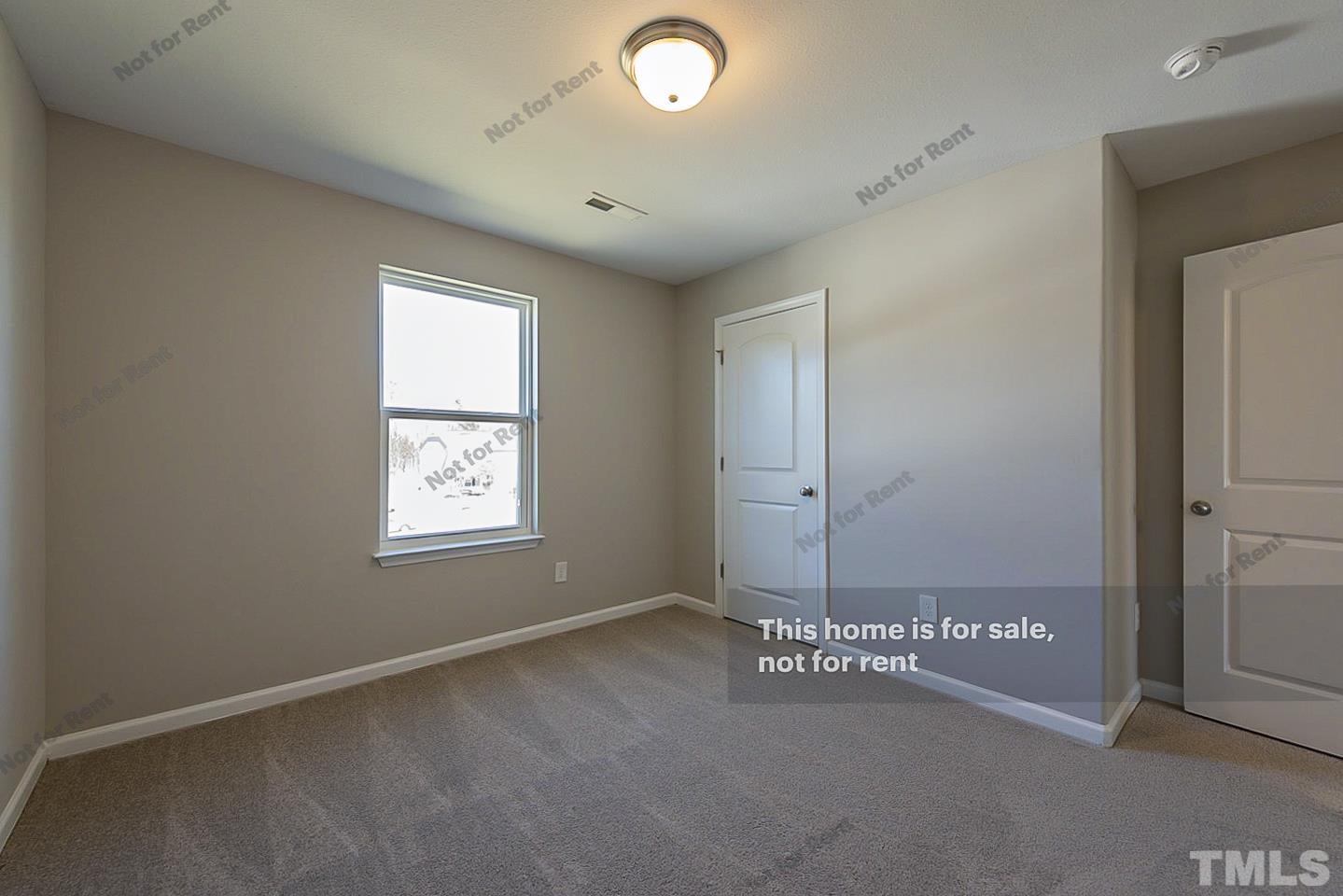 1908 Buffalo Way Durham, NC 27704 - Photo 21 of 26 an empty room with a empty space and windows