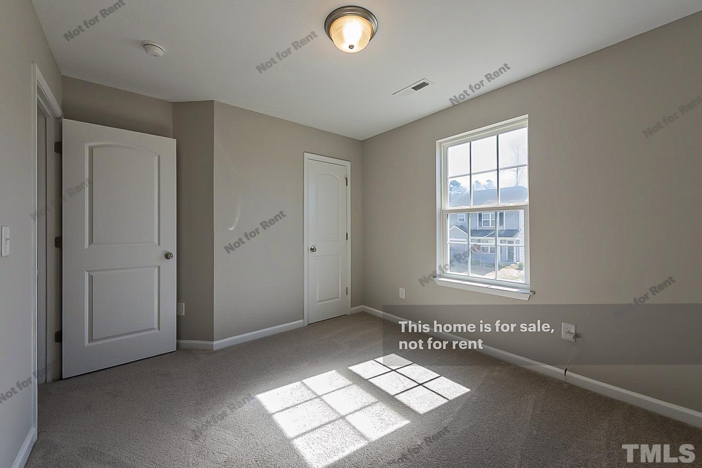 1908 Buffalo Way Durham, NC 27704 - Photo 22 of 26 an empty room with windows and closet