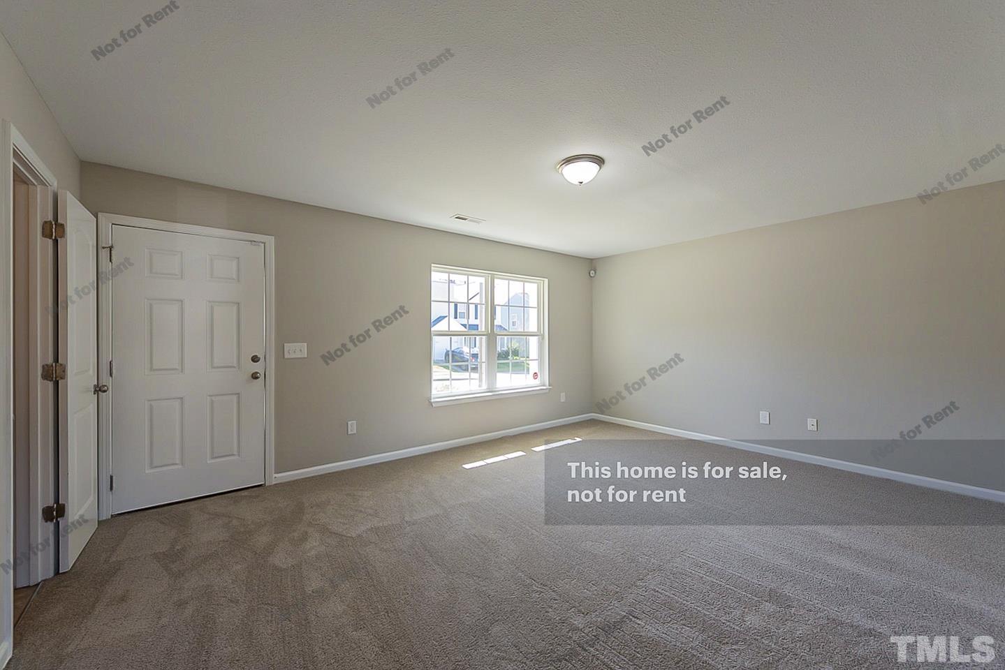 1908 Buffalo Way Durham, NC 27704 - Photo 3 of 26 a view of an empty room and window
