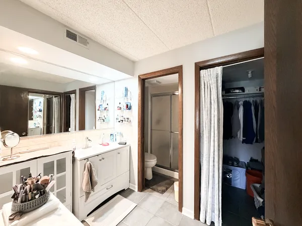 a room with a bed and a large window