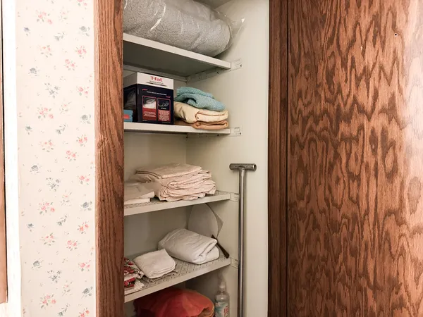 a room with a wooden floor and a chair
