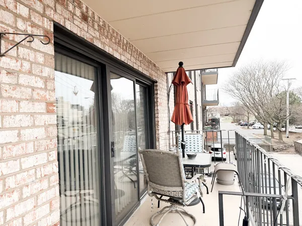 a view of balcony with furniture