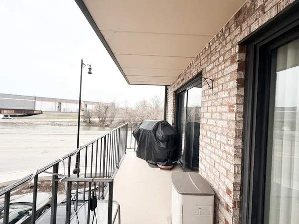 a view of balcony with furniture