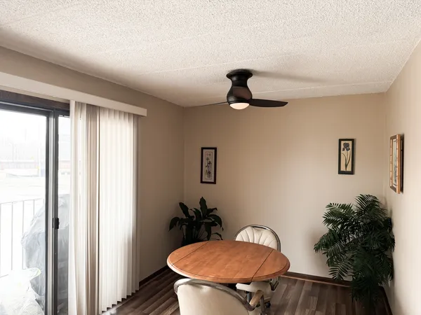 a view of a livingroom with furniture and a potted plant