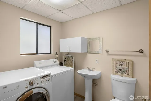 a utility room with dryer and washer