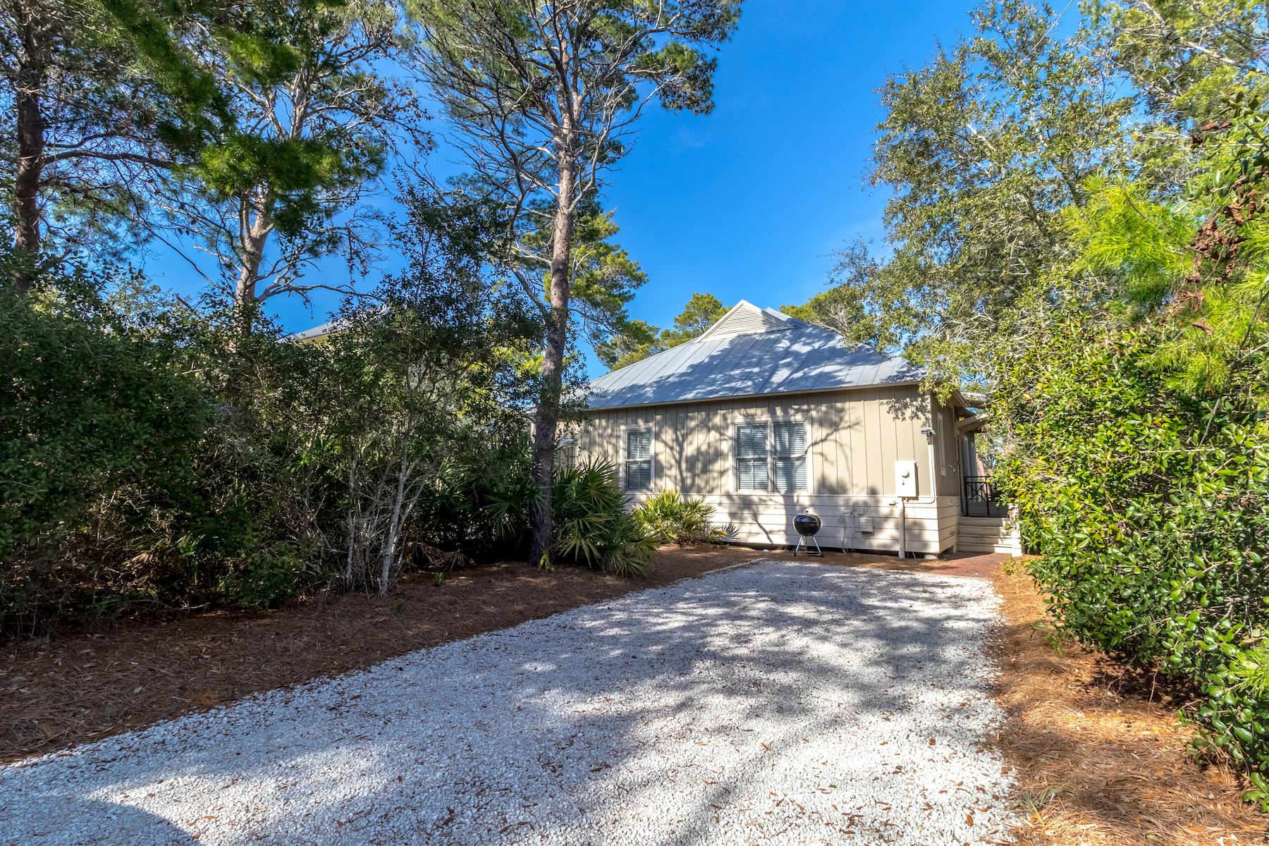 19 Vizcaya Lane Inlet Beach, FL 32461 - Photo 16 of 26 a view of a house with a tree in the background