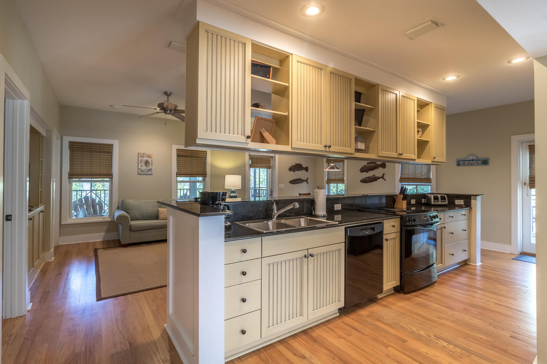 19 Vizcaya Lane Inlet Beach, FL 32461 - Photo 3 of 26 a kitchen with stainless steel appliances granite countertop a sink stove and wooden floor