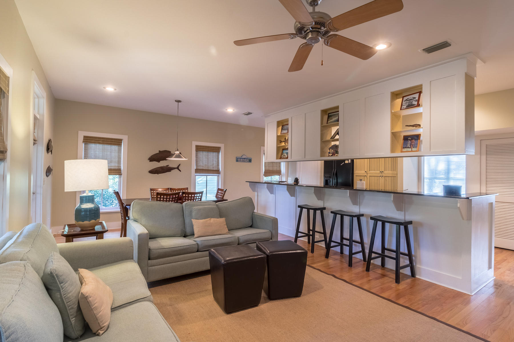 19 Vizcaya Lane Inlet Beach, FL 32461 - Photo 7 of 26 a living room with furniture a rug and a chandelier