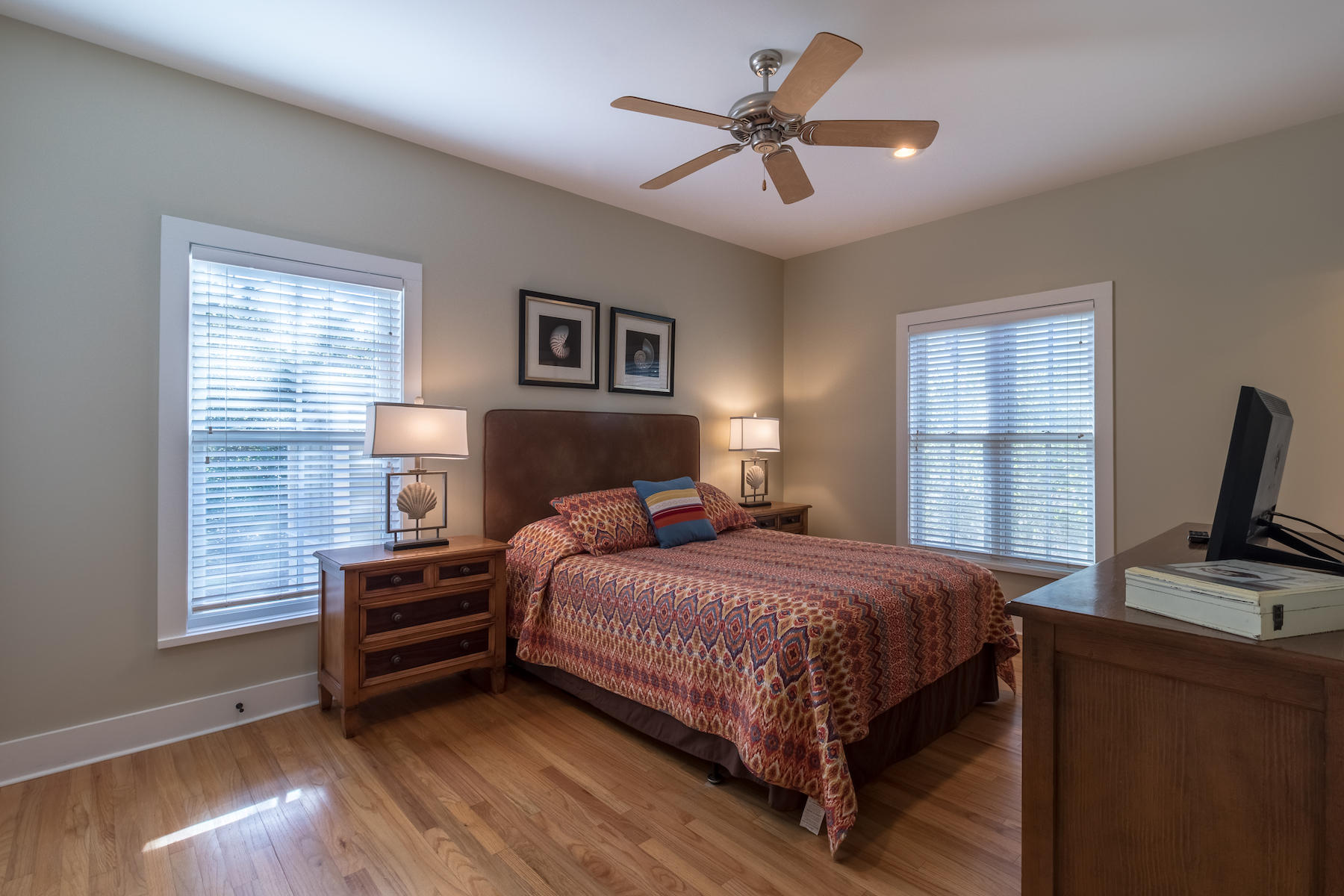 19 Vizcaya Lane Inlet Beach, FL 32461 - Photo 8 of 26 a bedroom with a bed next to a window with a bookshelf