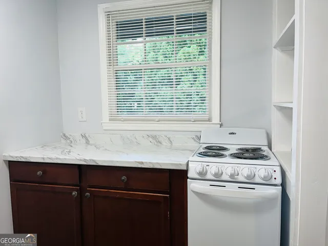 a kitchen with a stove and a sink