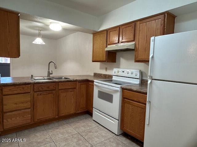 1843 N Spring, Unit 201 Mesa, AZ 85203 - Photo 2 of 24 a kitchen with granite countertop a sink stove and refrigerator