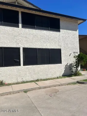 a backyard of a house with wooden floor