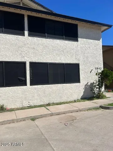 a backyard of a house with wooden floor