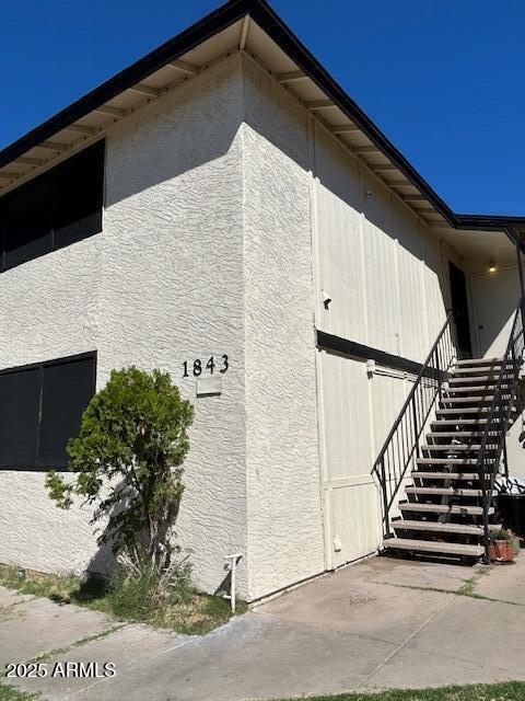 1843 N Spring, Unit 201 Mesa, AZ 85203 - Photo 22 of 24 a backyard of a house with wooden floor
