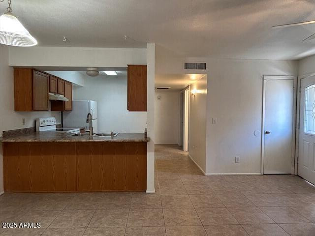 1843 N Spring, Unit 201 Mesa, AZ 85203 - Photo 3 of 23 a kitchen with stainless steel appliances granite countertop a refrigerator and a sink