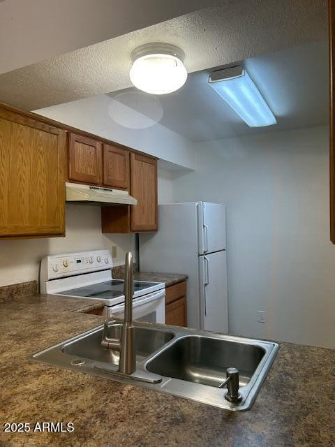 1843 N Spring, Unit 201 Mesa, AZ 85203 - Photo 4 of 23 a kitchen with kitchen island a sink stainless steel appliances and cabinets