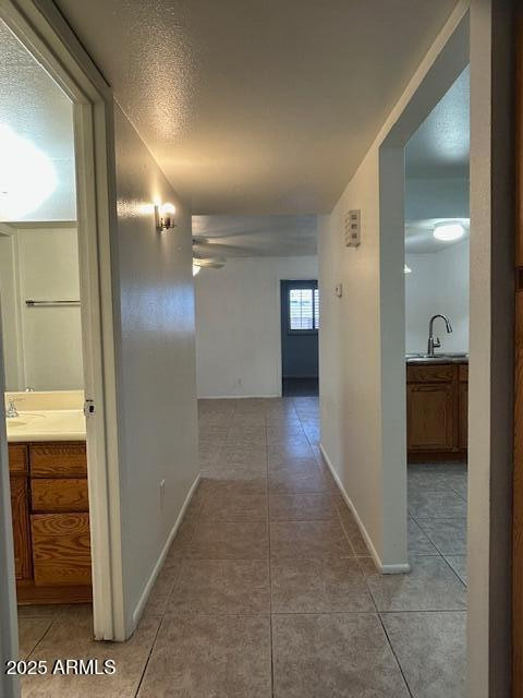 1843 N Spring, Unit 201 Mesa, AZ 85203 - Photo 8 of 23 a view of a hallway with some storage area
