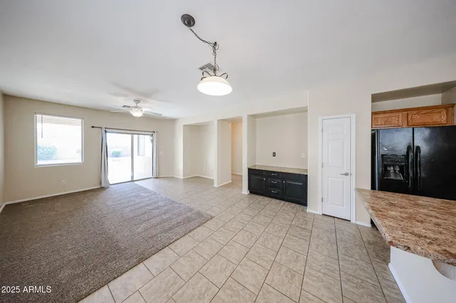 a view of a kitchen with a sink and a window