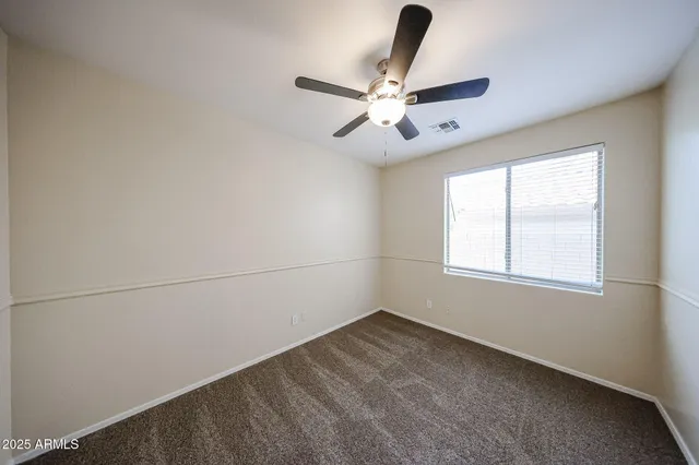 a view of a big room with carpet