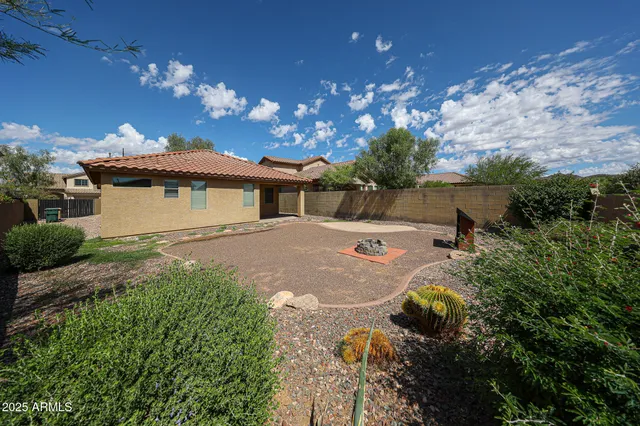 a view of a house with yard and a garden