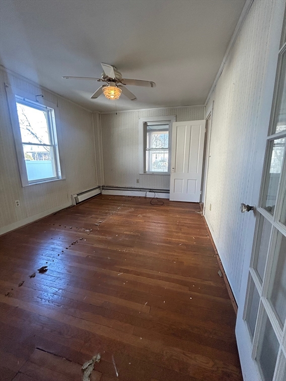 1 Dunlap Street Salem, MA 01970 - Photo 12 of 31 an empty room with wooden floor and windows