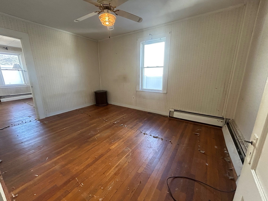 1 Dunlap Street Salem, MA 01970 - Photo 13 of 31 an empty room with wooden floor and windows