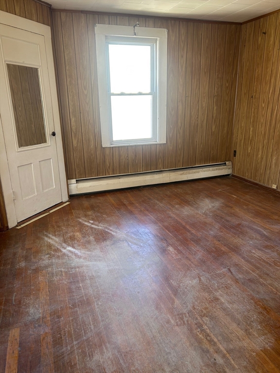 1 Dunlap Street Salem, MA 01970 - Photo 17 of 31 an empty room with wooden floor and windows
