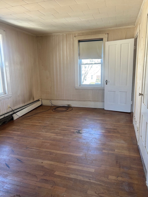 1 Dunlap Street Salem, MA 01970 - Photo 18 of 31 an empty room with wooden floor and windows