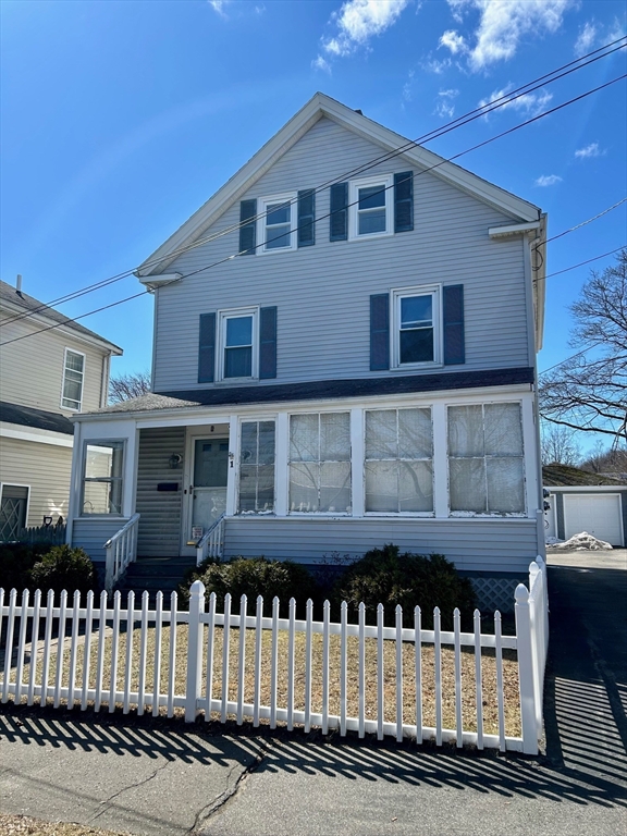 1 Dunlap Street Salem, MA 01970 - Photo 2 of 31 a front view of a house with a fence