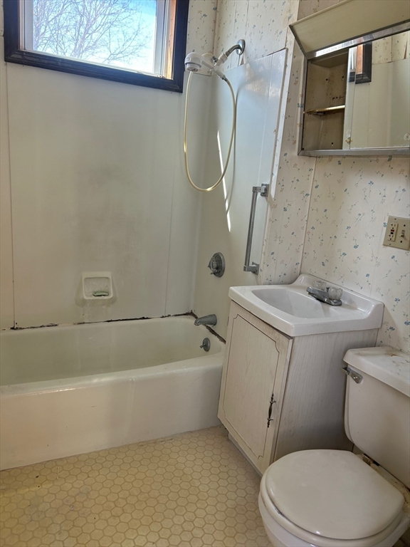 1 Dunlap Street Salem, MA 01970 - Photo 21 of 31 a bathroom with a sink a toilet and bathtub