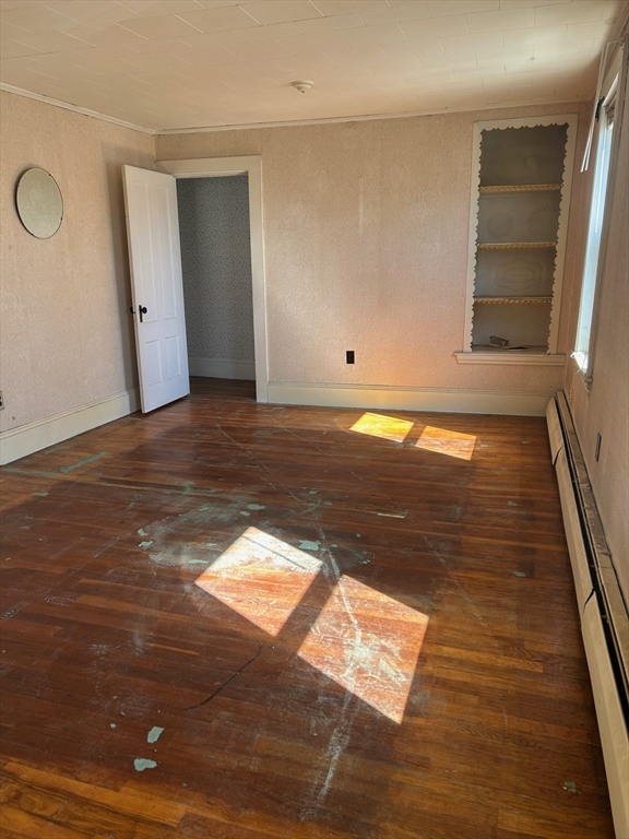 1 Dunlap Street Salem, MA 01970 - Photo 22 of 31 a view of an empty room with window and wooden floor