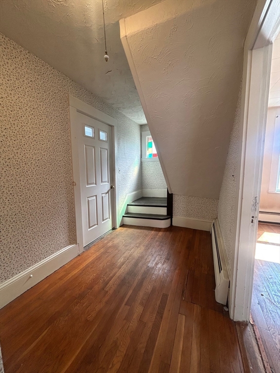 1 Dunlap Street Salem, MA 01970 - Photo 7 of 31 a view of an empty room with wooden floor and a window