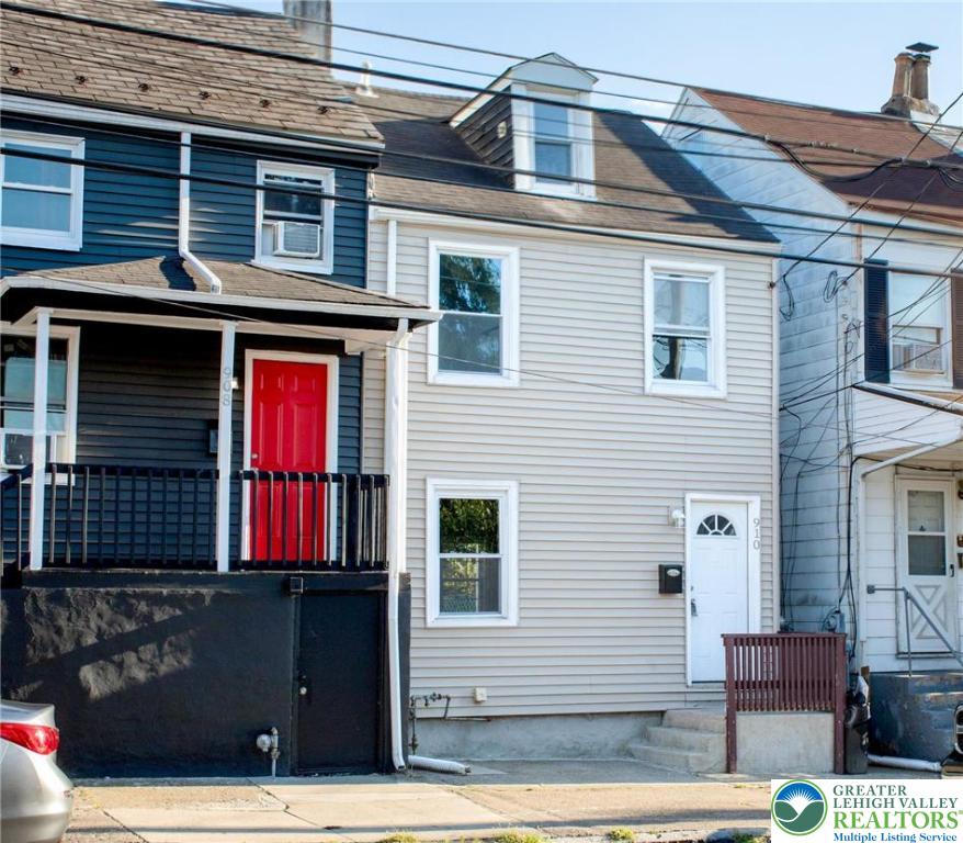 a front view of a house with a garage