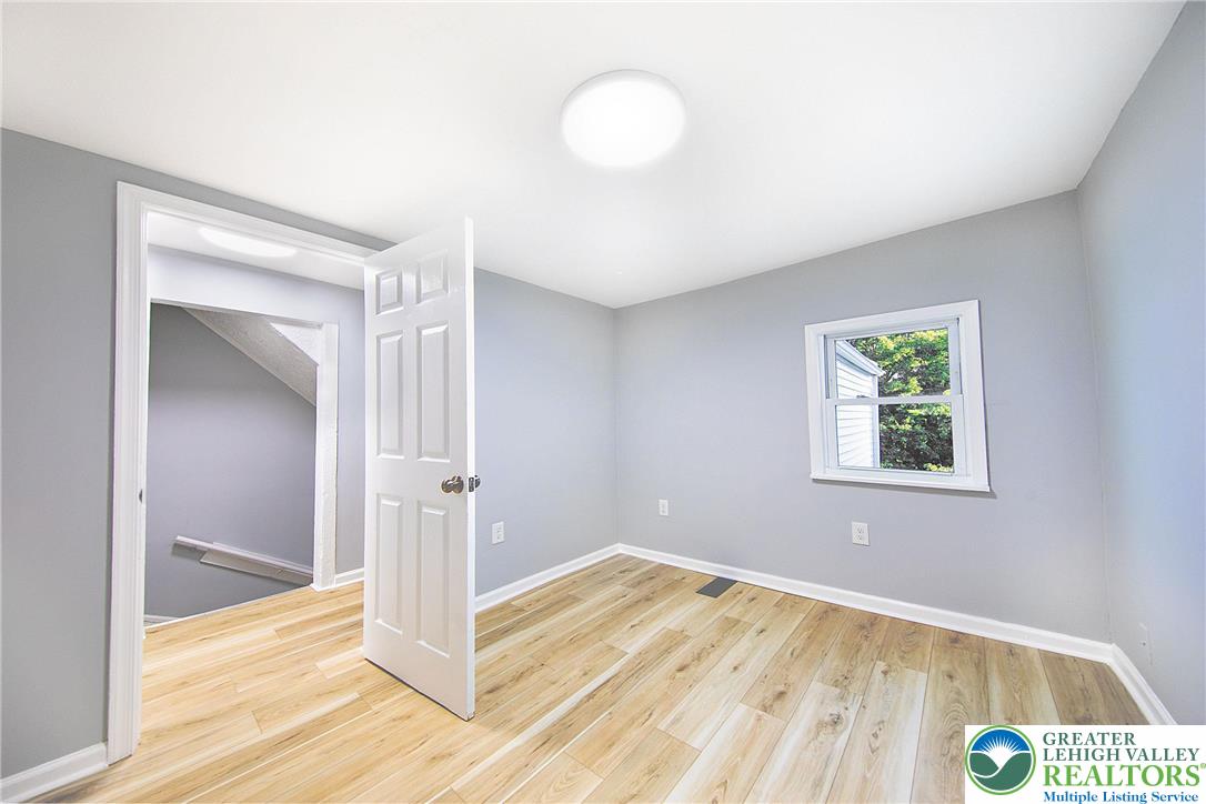 910 Butler Street Easton, PA 18042 - Photo 16 of 29 a view of a room with wooden floor and window