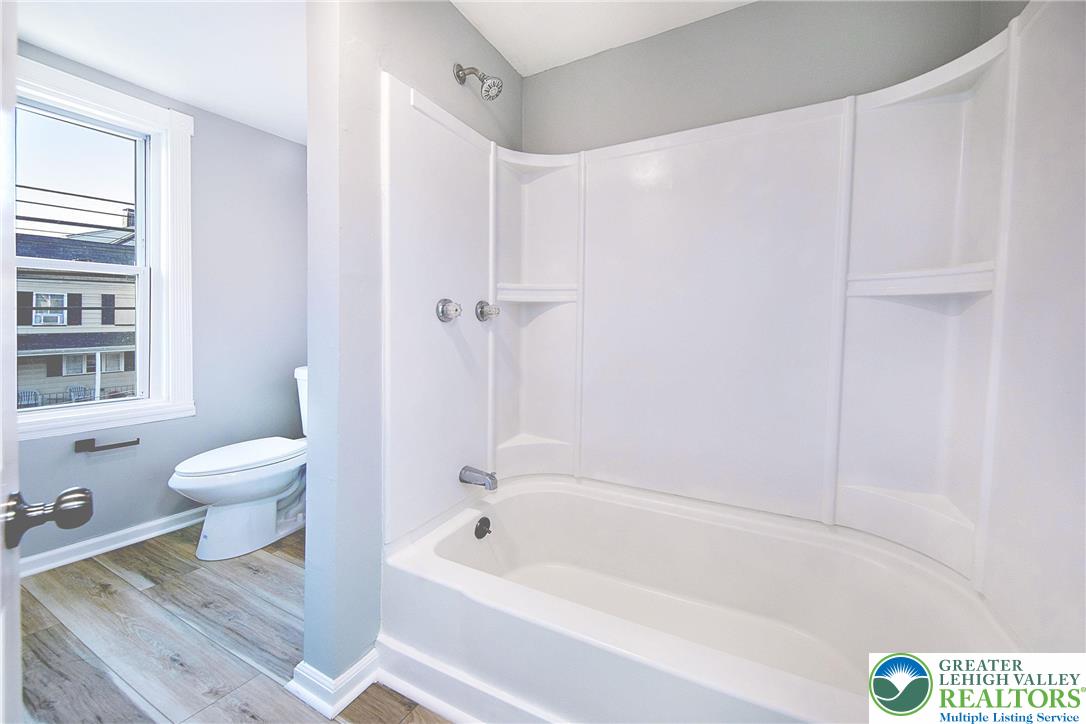910 Butler Street Easton, PA 18042 - Photo 18 of 29 a bath room with a toilet and a bath tub