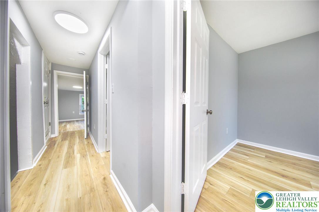 910 Butler Street Easton, PA 18042 - Photo 19 of 29 a view of a bedroom with wooden floor and bathroom