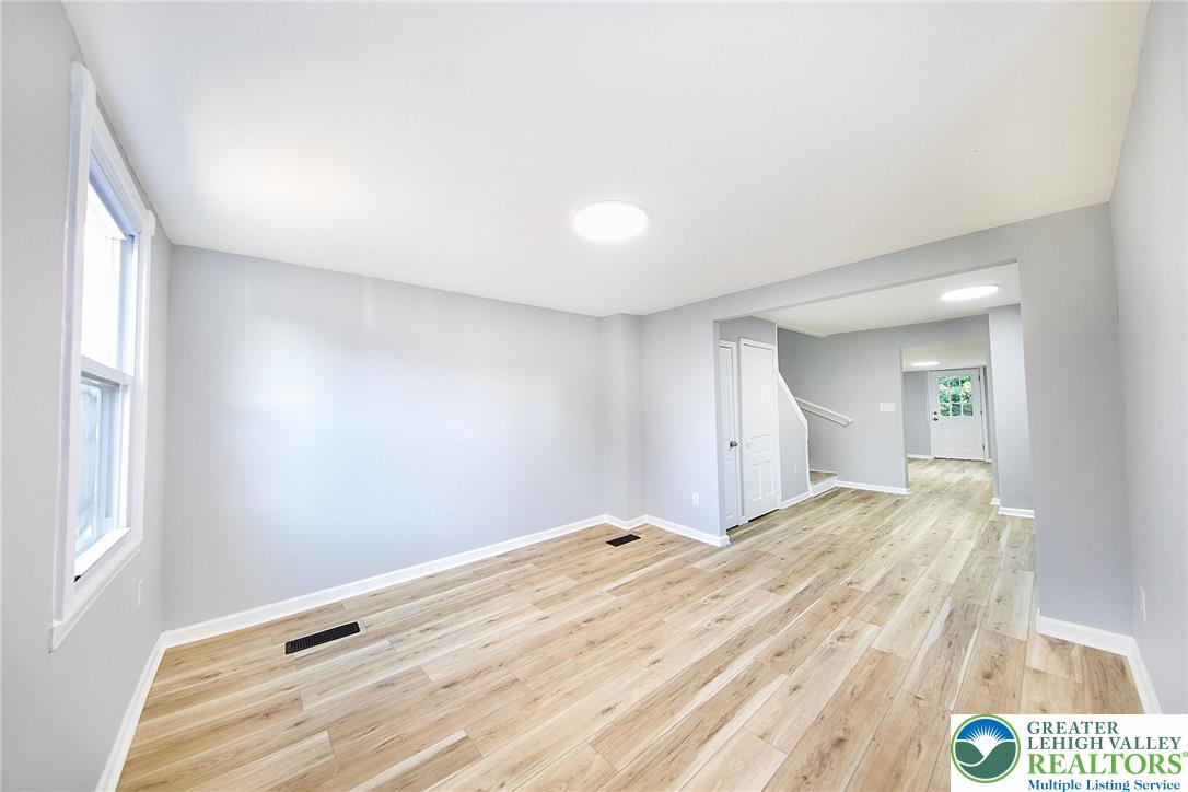 910 Butler Street Easton, PA 18042 - Photo 2 of 29 a view of a bedroom with wooden floor and bathroom