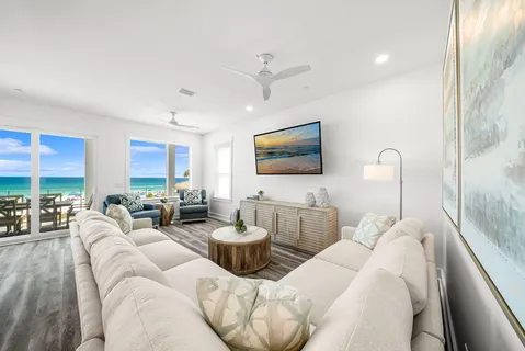 a view of a patio with dining table and chairs with wooden floor