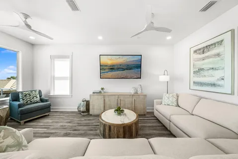 a view of a balcony with dining table and chairs