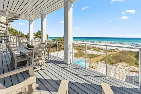 a bathroom with a granite countertop sink toilet and mirror