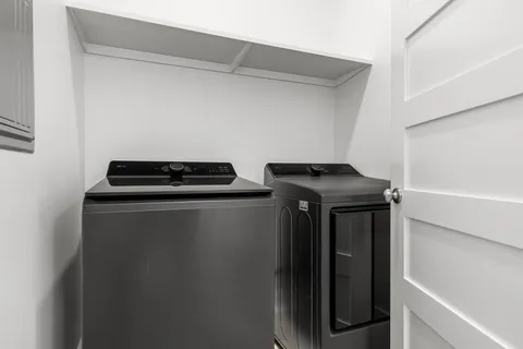 a kitchen with stainless steel appliances granite countertop a refrigerator stove and sink