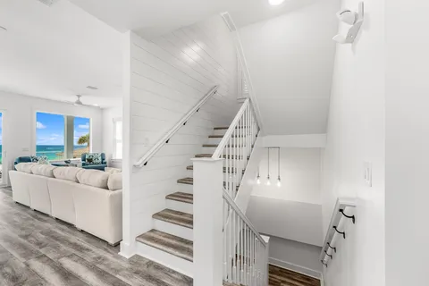 a bedroom with a bed and a flat tv screen on dresser