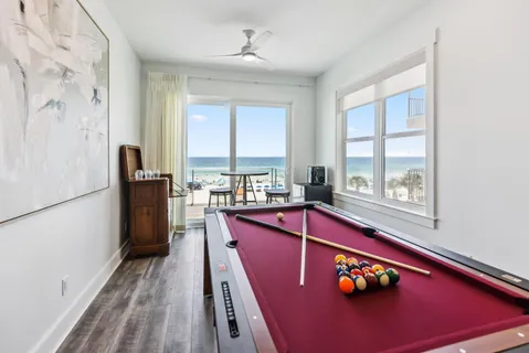 a bathroom with a granite countertop sink a toilet and a shower