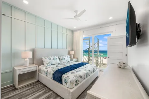 a bathroom with a granite countertop sink toilet and mirror