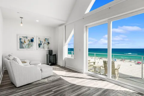 a front view of a building with a swimming pool