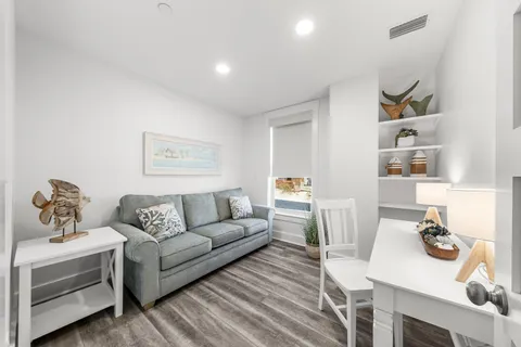 a kitchen with stainless steel appliances kitchen island granite countertop a kitchen island a stove a refrigerator and a sink