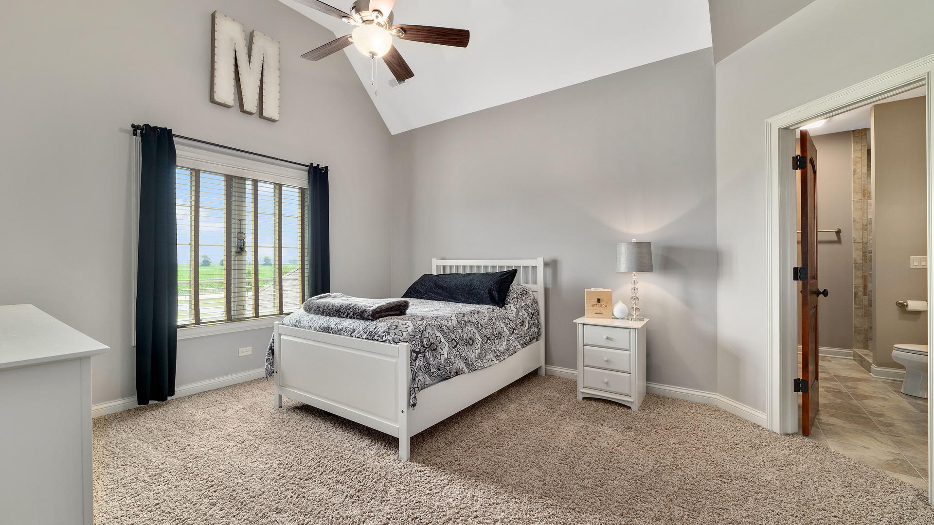 44-w230 Scott Road Sugar Grove, IL 60554 - Photo 26 of 44 a bedroom with a bed and a chandelier