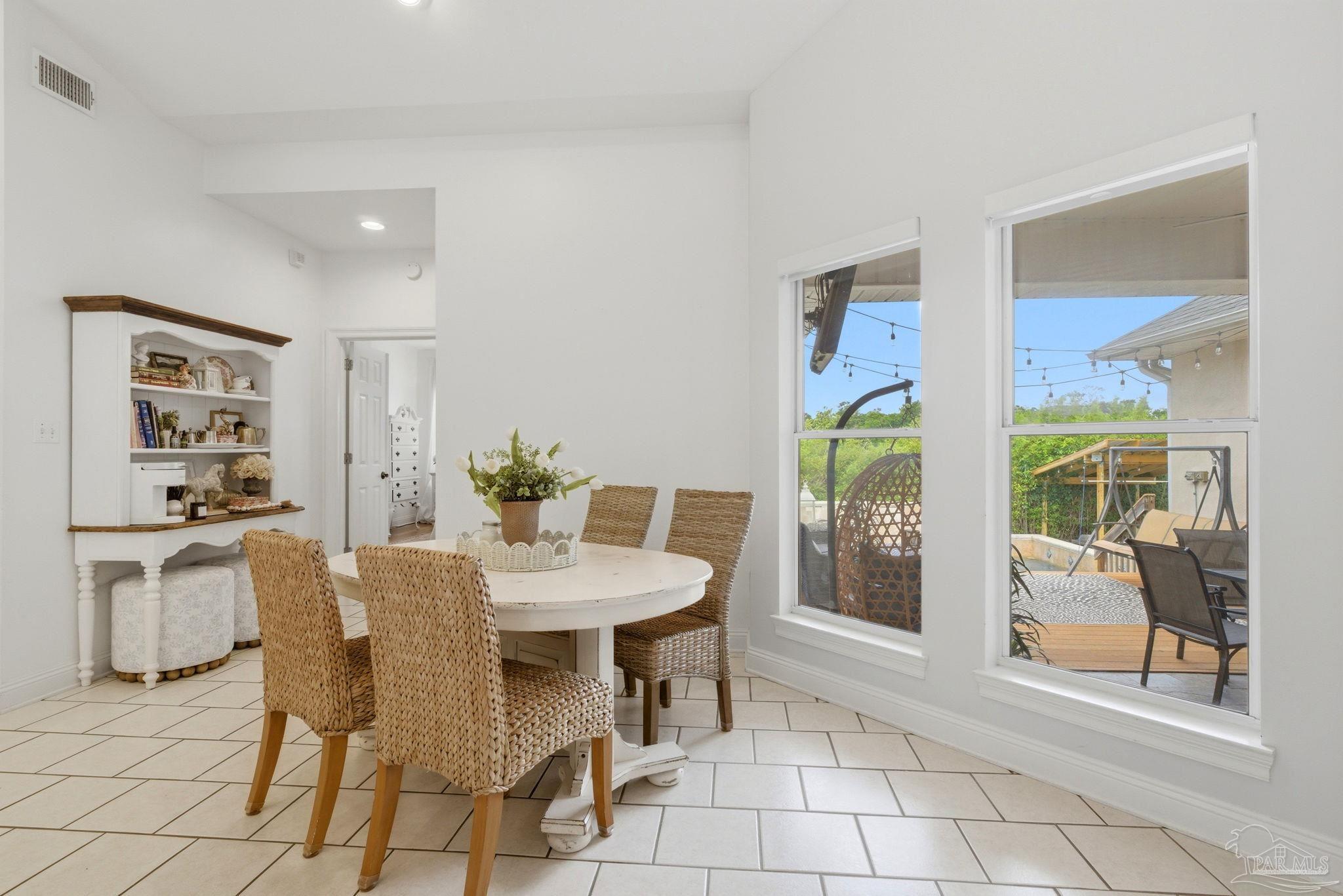 5931 Otter Point Road Pensacola, FL 32504 - Photo 15 of 67 a dining room with furniture and window