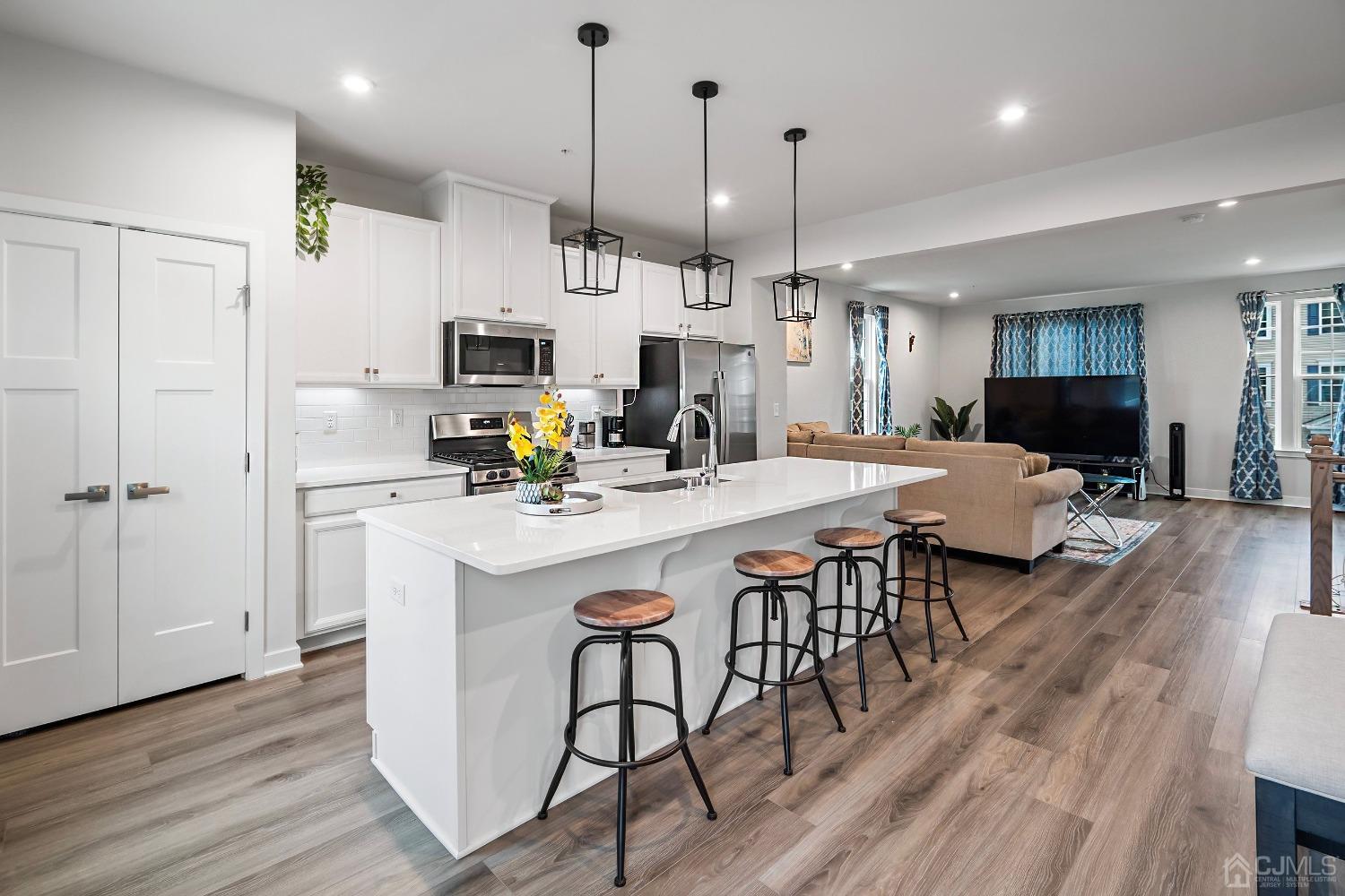 26 American Way Cliffwood, NJ 07721 - Photo 14 of 32 a large kitchen with a table and chairs