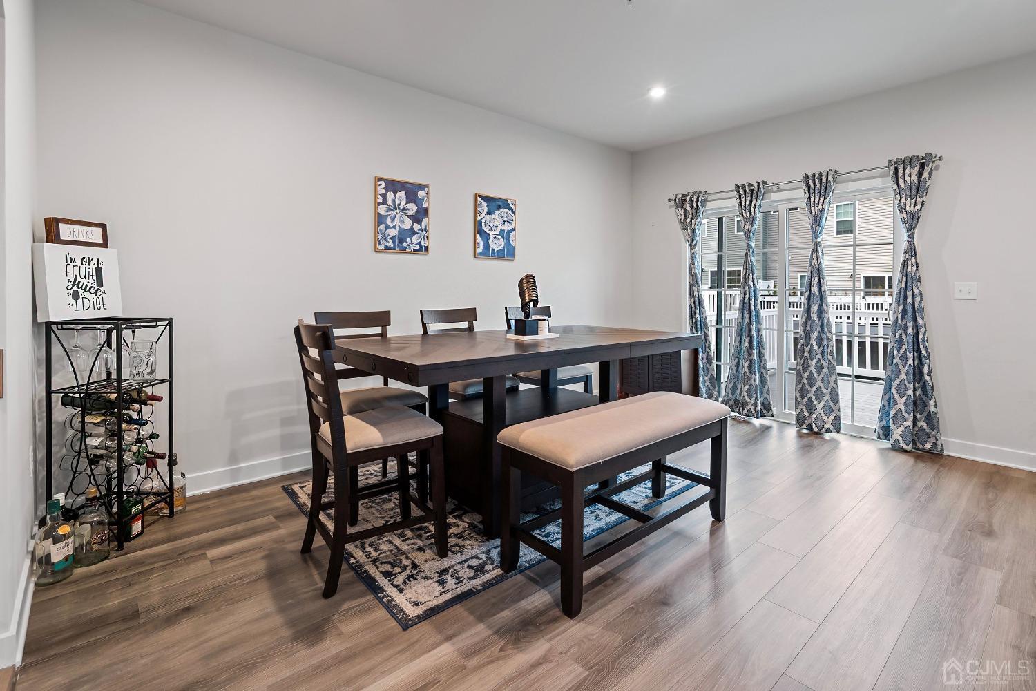 26 American Way Cliffwood, NJ 07721 - Photo 17 of 32 a view of a dining room with furniture and wooden floor
